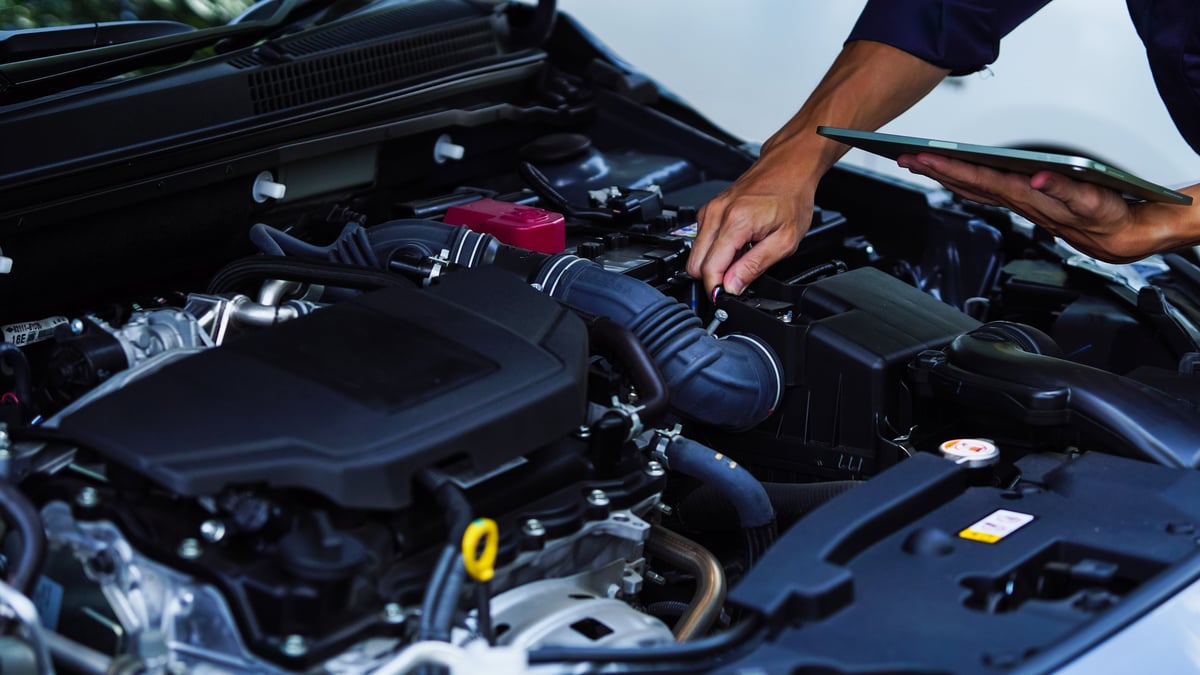 Mechanic working on car engine - expert automotive service